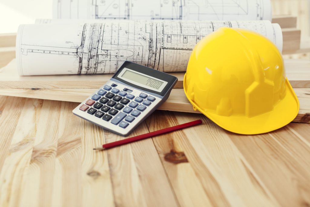 a calculator and a hard hat on a table