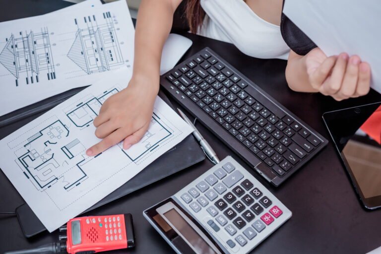 Construction cost consultant working at an office desk